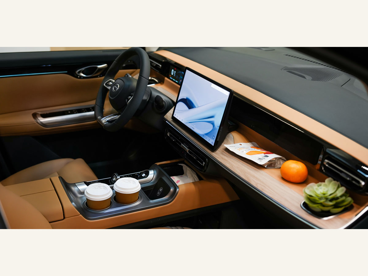 The interior and digital cockpit of a GAC Trumpchi new energy vehicle.